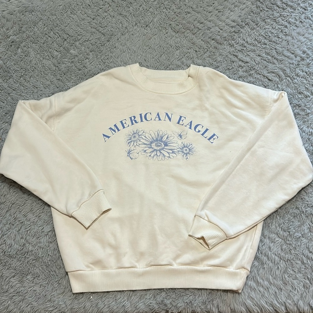 American Eagle sweater with flower and butterfly designs